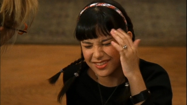 Miranda sitting on the floor and checking her head on Lizzie McGuire