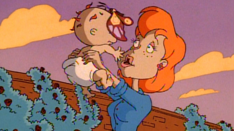 Chuckie's mother holding him up in the air on Rugrats