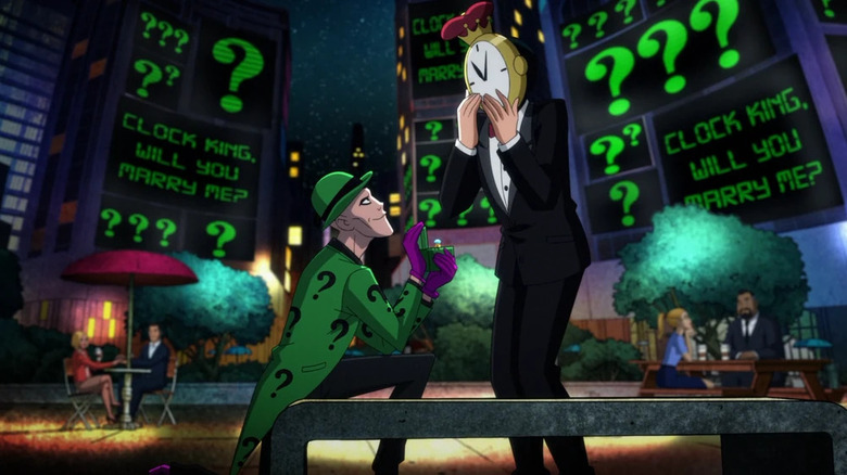 Riddler (dressed in green) on one knee proposing to Clock King in Harley Quinn