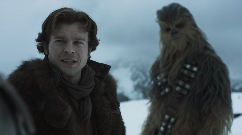 Han Solo and Chewbacca standing in the snow