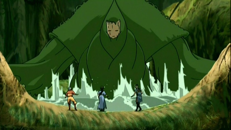 Aang, Katara, and Sokka stand before an enormous swamp creature