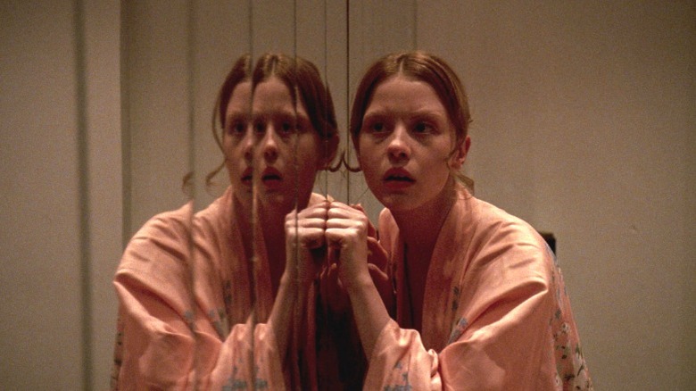 Mia Goth and mirror