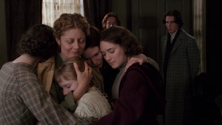 The women of the March family embracing in Little Women