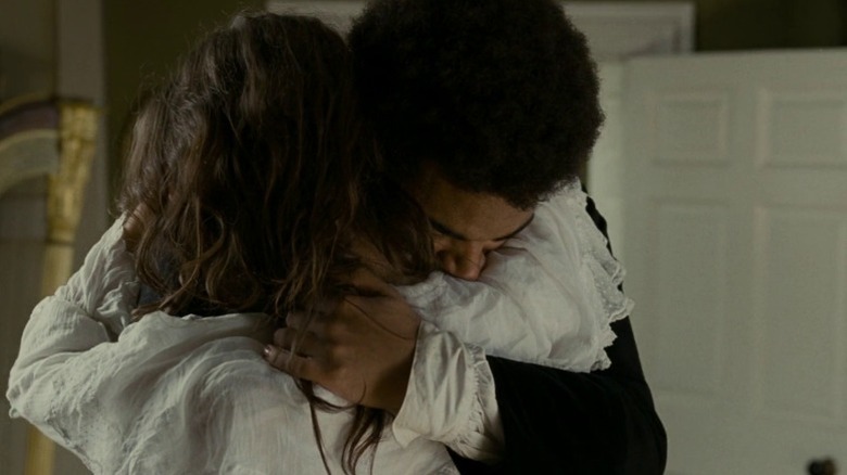 James Howson as Heathcliff tearfully embracing Kaya Scodelario as Catherine Earshaw in Wuthering Heights