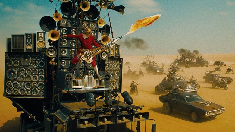 The Doof Warrior plays atop The Doof Wagon as Joe's posse travels in the desert in Mad Max: Fury Road (2015)