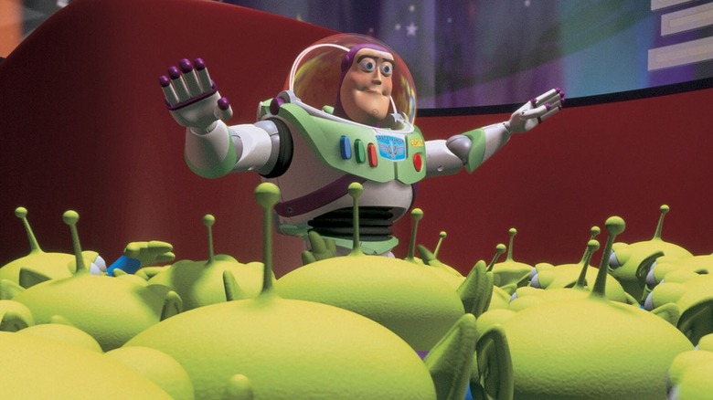 Buzz calming down a crowd of little green aliens in Toy Story (1995)