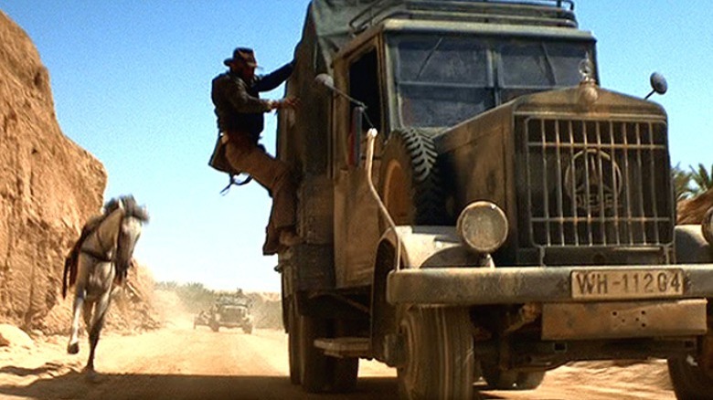 Indiana Jones jumping towards a moving truck