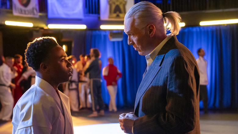 Thomas Ian Griffith as Terry Silver tempts Kenny (Dallas Dupree Young) in "Cobra Kai"