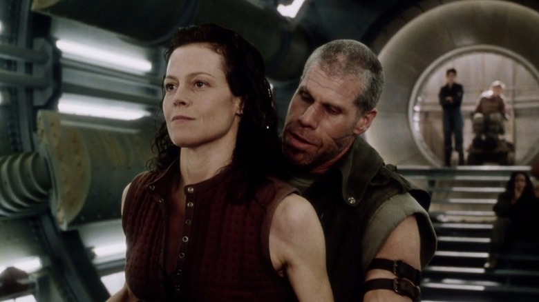 A mercenary cozies up to Ripley 8 in Alien: Resurrection