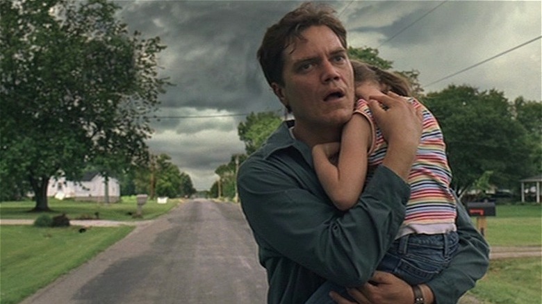 Michael Shannon holding child in Take Shelter