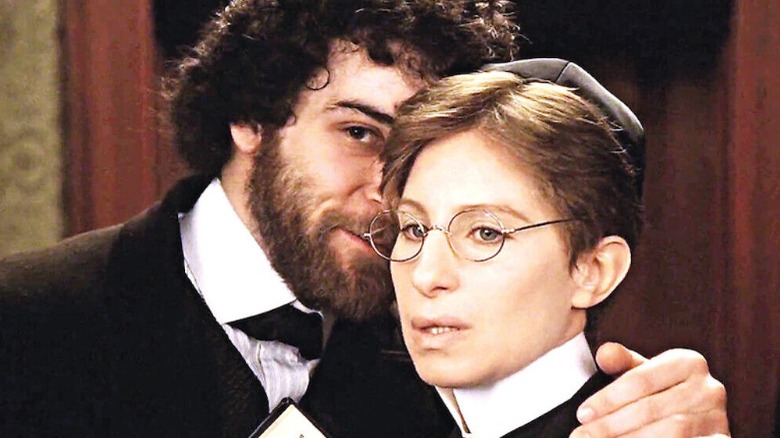 Mandy Patinkin whispering to Barbra Streisand