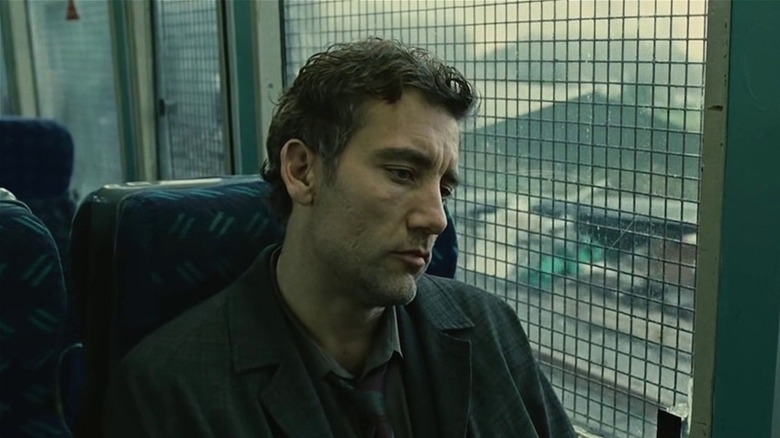 Theo Faron looks sadly out train window