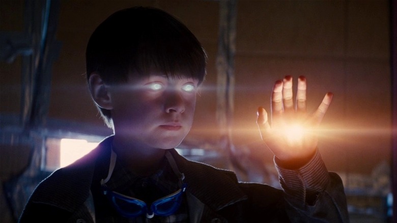 Alton holds up a glowing hand in front of his glowing eyes