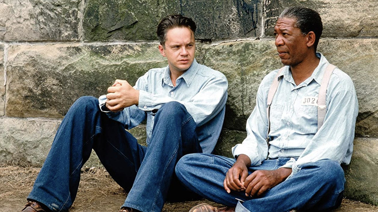 Andy Dufresne and Red sitting on a prison wall