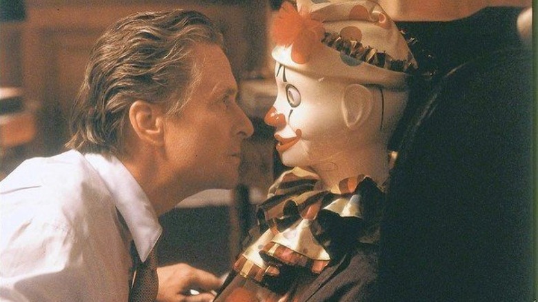 Michael Douglas with creepy toy