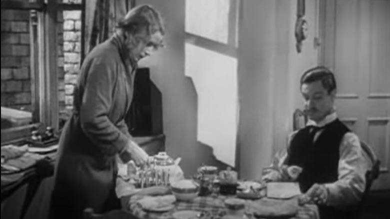 Deborah Kerr sets table for Robert Donat in "Vacation from Marriage"