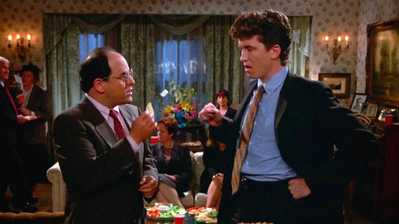 Jason Alexander as George being yelled at by a partygoer for double-dipping in Seinfeld