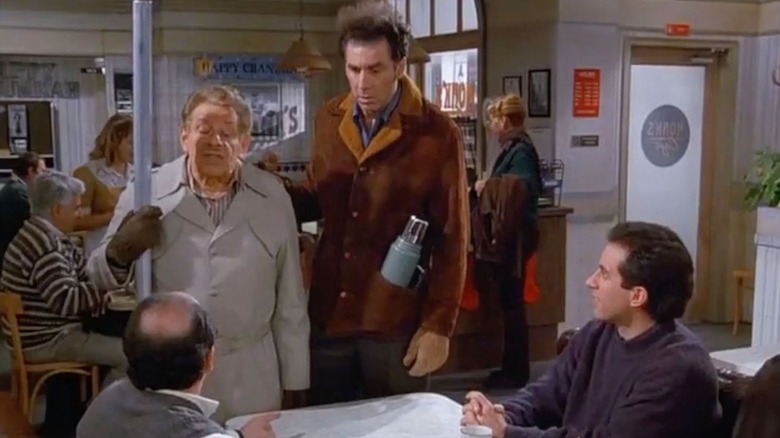 Jerry Stiller as Frank with a Festivus pole next to Michael Richards as Kramer, Seinfeld as Jerry, and Alexander as George in Seinfeld