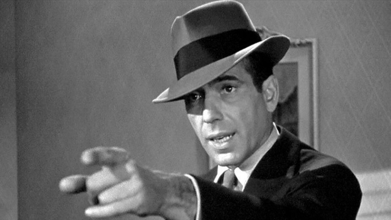 Humphrey Bogart as Sam Spade, wearing a trilby