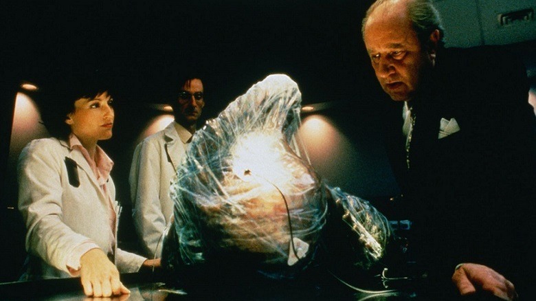 Bartok oversees an experiment with his lab team