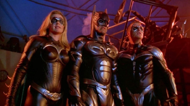 Batgirl, Batman and Robin pose heroically