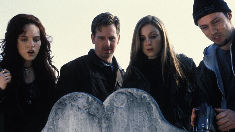 Goths pose around grave stone Blair Witch 2