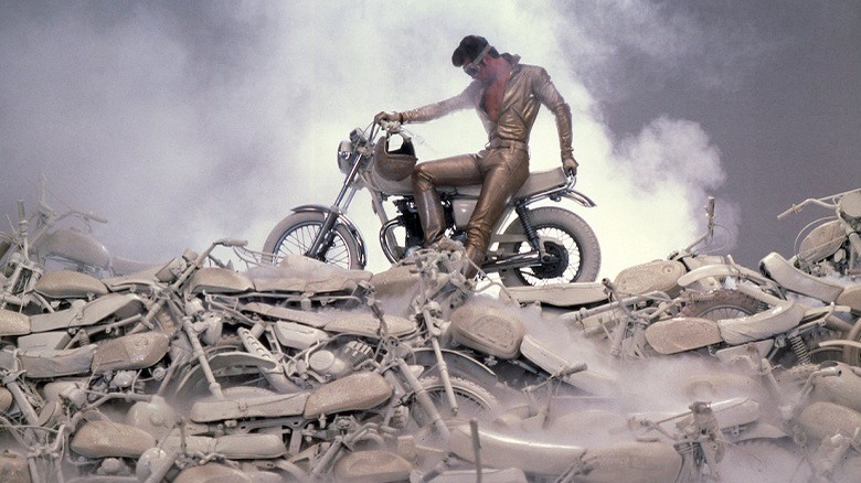 Michael poses on his motorcycle in a dream sequence