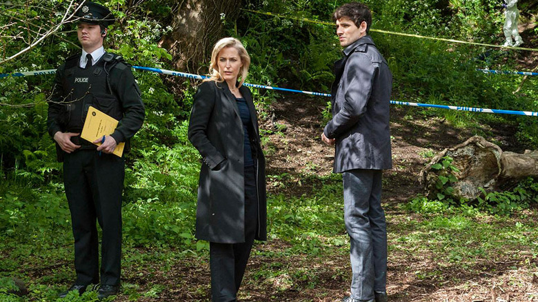 Gillian Anderson and Colin Morgan at a crime scene