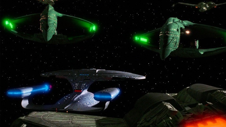 The Enterprise surrounded by Romulan Warbirds.
