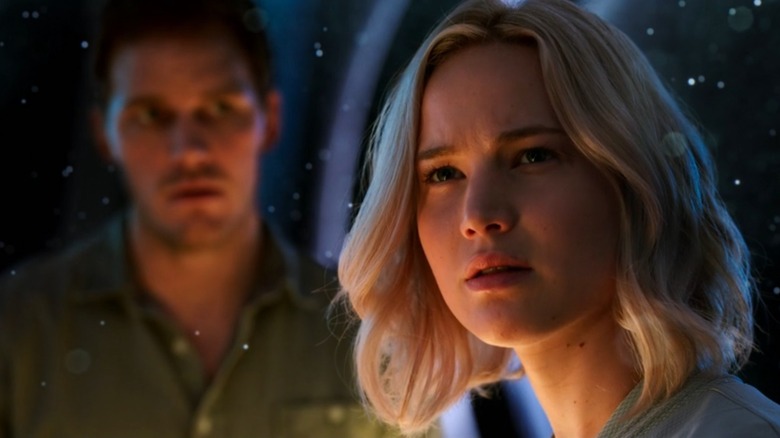 Chris Pratt as Jim and Jennifer Lawrence as Aurora surrounded by stars in Passengers