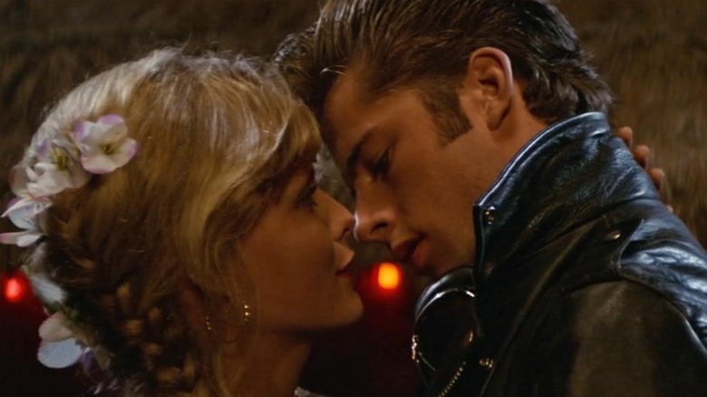 Michelle Pfeiffer as Stephanie and Maxwell Caulfield as Michael in Grease 2, getting ready to kiss