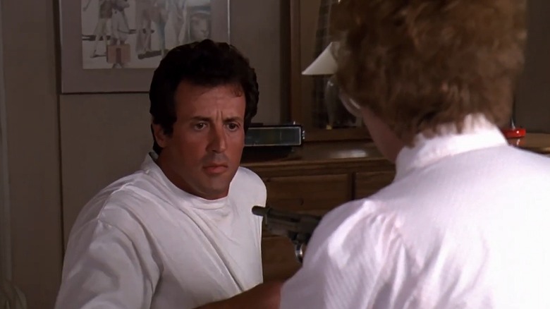 Sylvester Stallone as Joe Bomowski in Stop or My Mom Will Shoot, reacting to a gun being pointed at him