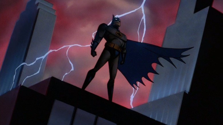 Batman standing and lightning striking