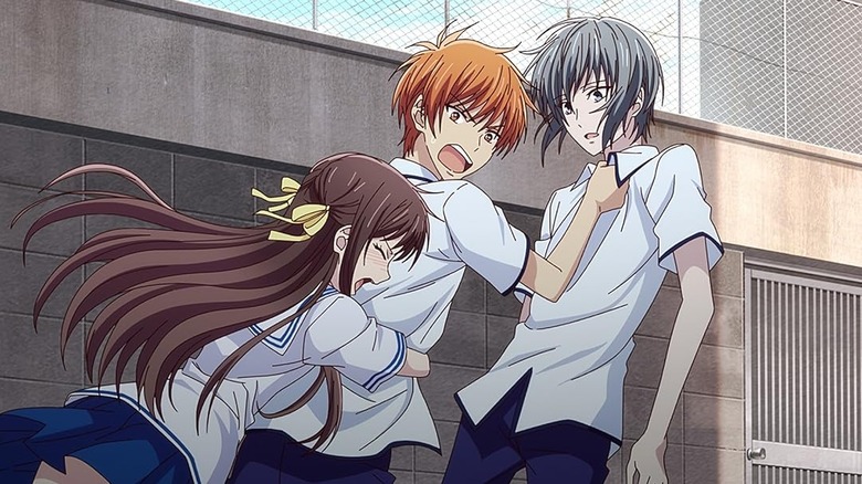 Tohru embraces Kyo as he grabs Hatsuharu on Fruits Basket