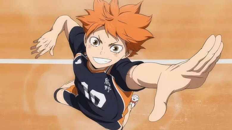 Hinata jumps up to spike a volleyball on Haikyu!!