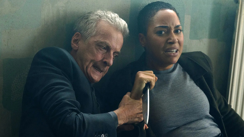 Peter Capaldi and Cush Jumbo as Daniel Hegarty and June Lenker wrestling for a knife in Criminal Record