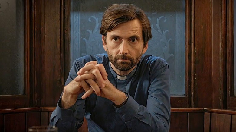 David Tennant as Harry, in religious wear and sitting in a church in Inside Man