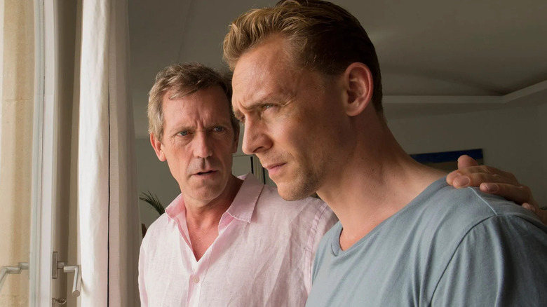 Hugh Laurie's Richard Roper puts his arm around Tom Hiddleston's Jonathan Pine in The Night Manager