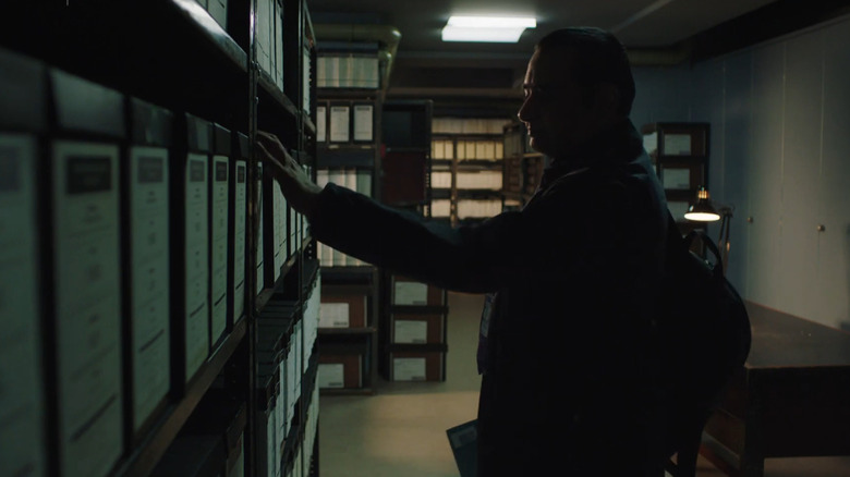 Sanjeev Bhaskar as Sunny Khan perusing the file room in Unforgotten