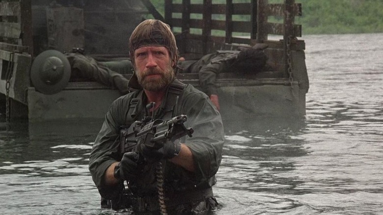 Chuck Norris as Braddock pointing gun in Missing in Action