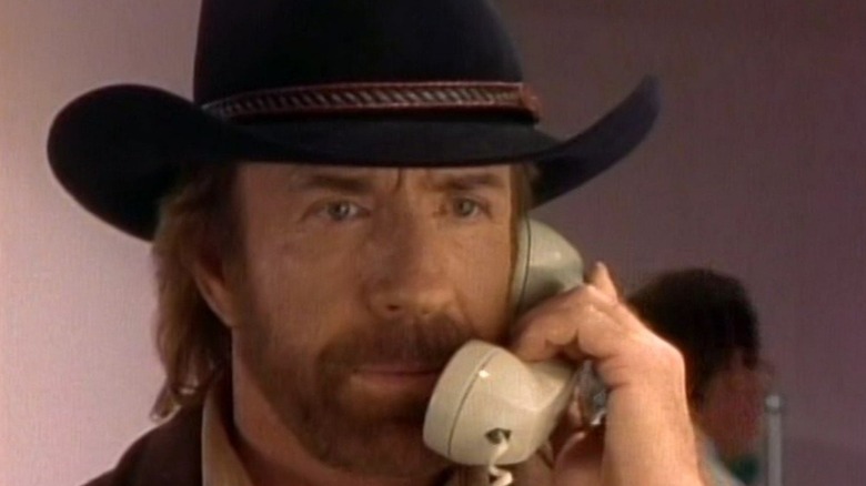 Chuck Norris as Walker talks on the phone on Walker Texas Ranger