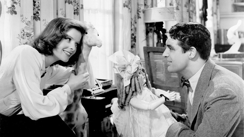Katherine Hepburn and Cary Grant holding toys