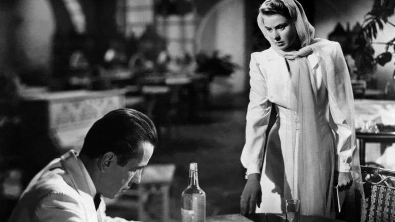 Ingrid Bergman looking down at drunk Humphrey Bogart Casablanca