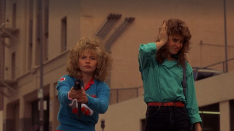 Sam (Kelli Maroney) and Reggie (Catherine Mary Stewart) shooting practice in Night of the Comet