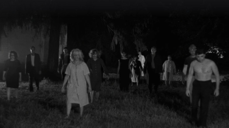 Zombies walking across lawn in Night of the Living Dead