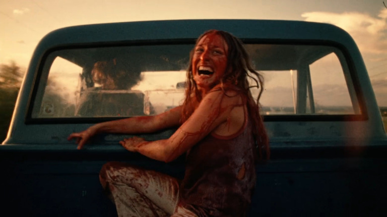 Sally (Marilyn Burns) laughing in back of truck in The Texas Chain Saw Massacre