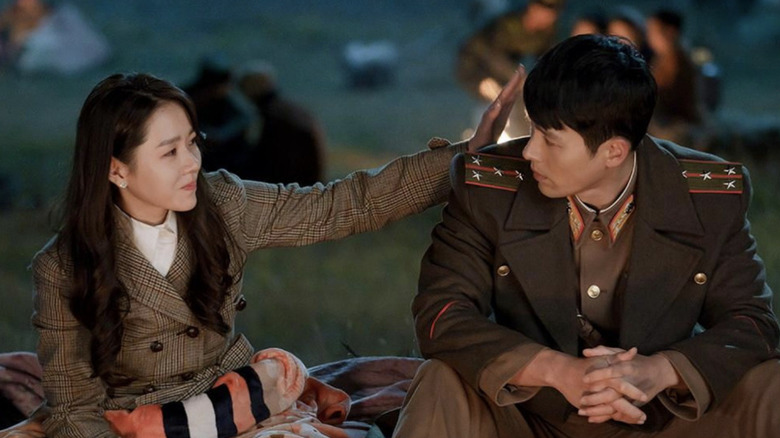 Yoon Se-ri (Son Ye-jin) touches the hair of Ri Jeong-hyeok (Hyun Bin) in Crash Landing on You