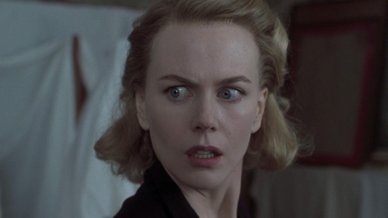 Closeup of Nicole Kidman as Grace looking shocked in The Others.