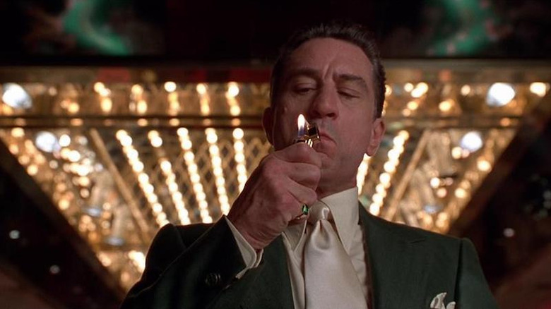 Sam Rothstein (Robert De Niro) lights a cigarette in Casino