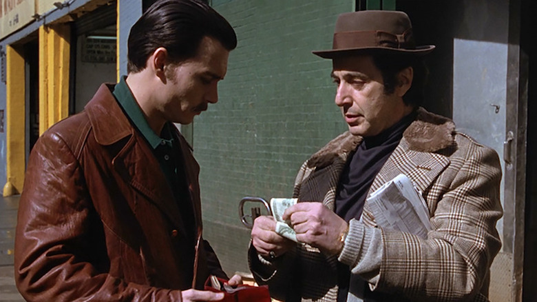 Lefty Ruggiero (Al Pacino) exchanges money with Donnie Brasco (Johnny Depp) Donnie Brasco